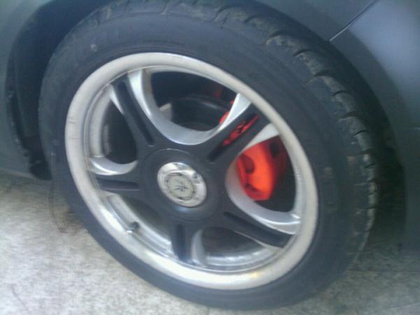 17 black and grey wheels, with orange calipers