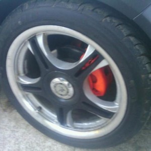 17 black and grey wheels, with orange calipers