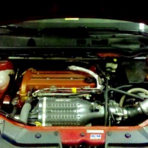 IMG 20110508 034726 edit0:
This is a picture of the engine bay.  Headlight conversion with 6000k hid's.  Tvs 1320 blower (2.8" pulley), option b kit,