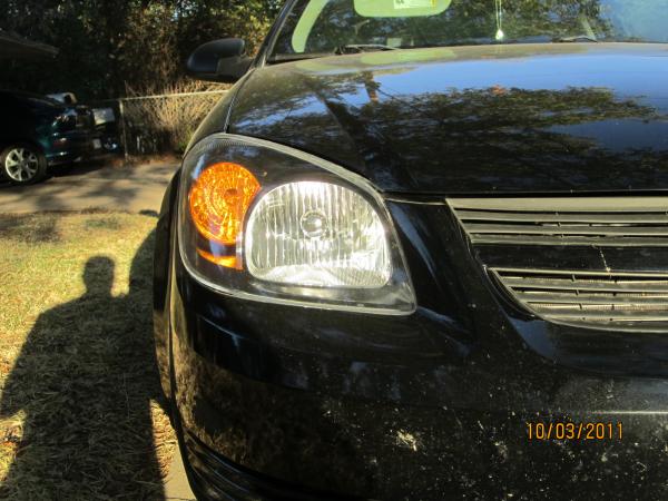 black satin rustoium on the chrome of the headlight housing