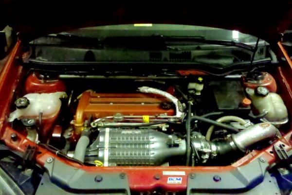 IMG 20110508 034726 edit0:
This is a picture of the engine bay.  Headlight conversion with 6000k hid's.  Tvs 1320 blower (2.8" pulley), option b kit,